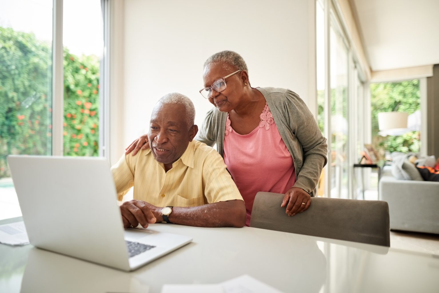 senior couple at laptop gettyimages 1178603331